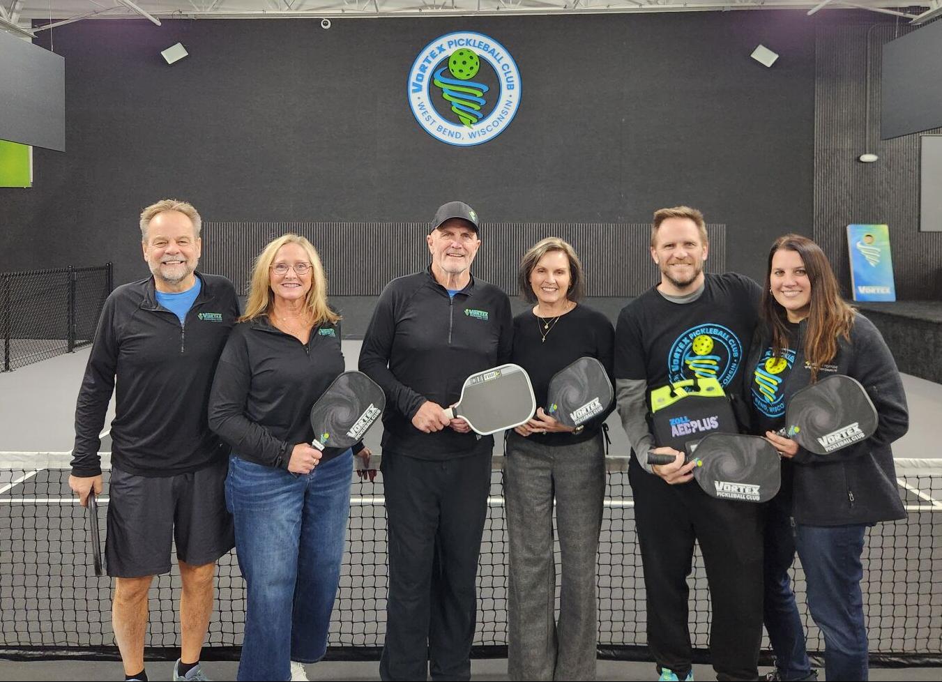 6926fa2ff255c.image From left: Vortex Pickleball Manager Steve Czisny, Tracy Hokanson, Mike McGuire, Deb McGuire, and Vortex Pickleball owners Patrick Prescott and Lori Prescott at Vortex Pickleball, 1285 W. Paradise Drive, West Bend.