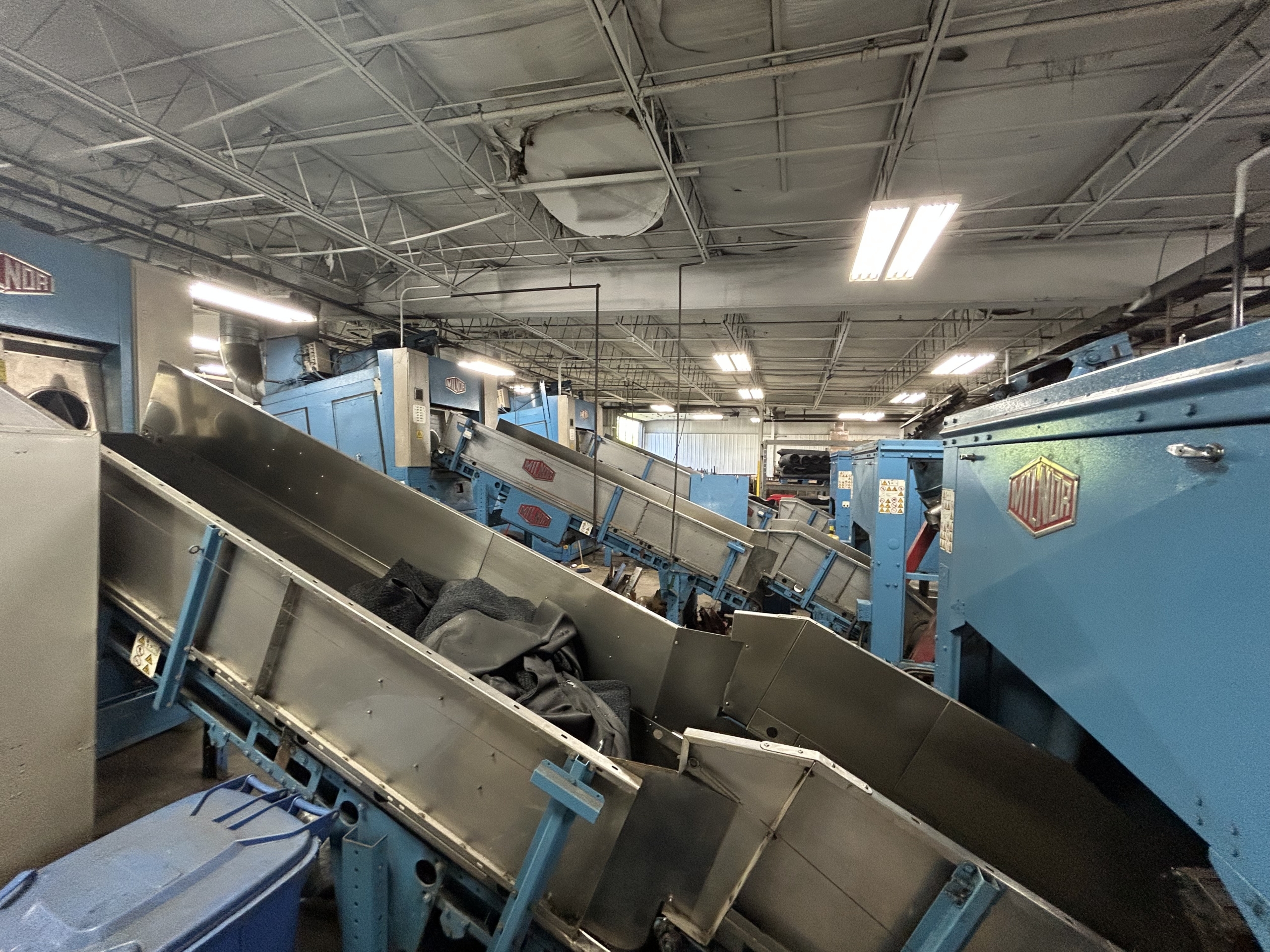 Packerland’s warehouse includes sustainability practices, like reclaiming heat from the laundry process.