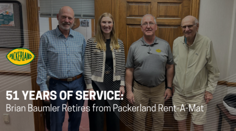 Three generations of Schultz family members pose with Brian Baumler, who retired from Packerland after 51 years.