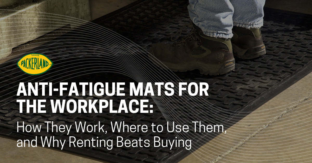 Anti-Fatigue Commercial Floor Mats in Wisconsin A man's feet are shown wearing steel toed boots stands on a black commercial anti-fatigue floor mat.